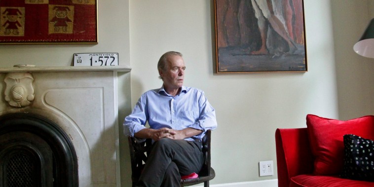 British novelist Martin Amis poses in the living room of his new home in the Brooklyn borough of New York on Aug. 17, 2012. 
