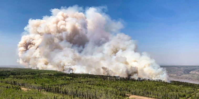 A wildfire burns a section of forest in the Grande Prairie district of Alberta, Canada on May 6, 2023.