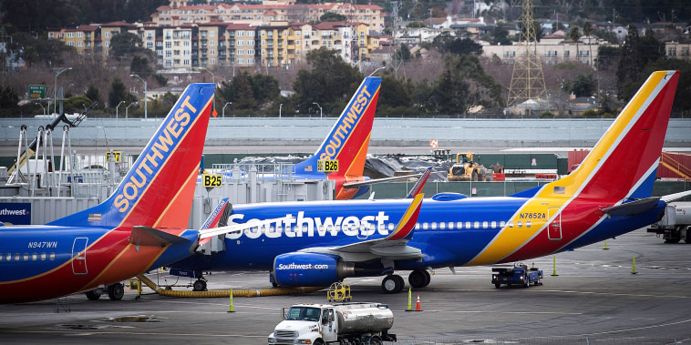 Southwest Airlines Co. planes stand on the tarmac at San Francisco International Airport (SFO) in San Francisco, California, U.S., on Friday, Jan. 19, 2018. Southwest Airlines Co. is scheduled to release earnings on January 25. Photographer: David Paul Morris/Bloomberg via Getty Images