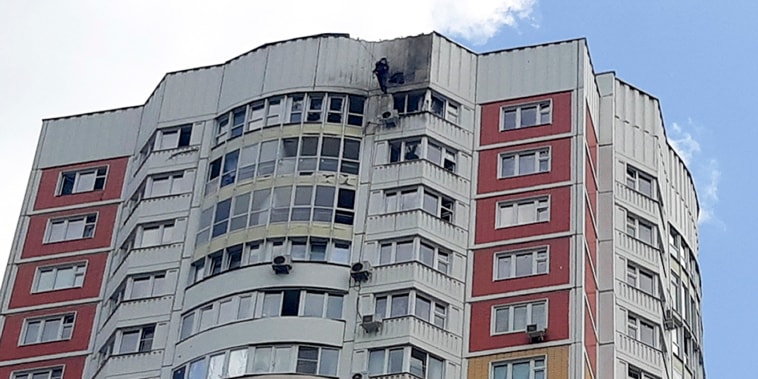 An investigator inspects a damage after a Ukrainian drone attacked an apartment building in Moscow, Russia, Tuesday, May 30, 2023. In Moscow, residents reported hearing explosions and Mayor Sergei Sobyanin later confirmed there had been a drone attack that he said caused "insignificant" damage. (AP Photo)