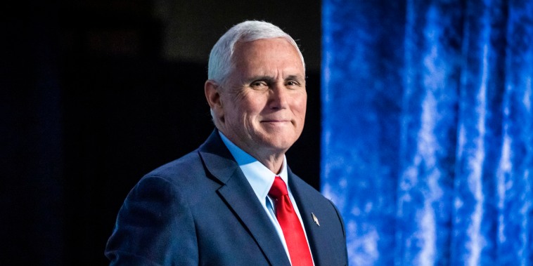 Image: Former Vice President Mike Pence stands to depart after speaking during the National Review Ideas Summit on March 31, 2023, in Washington.