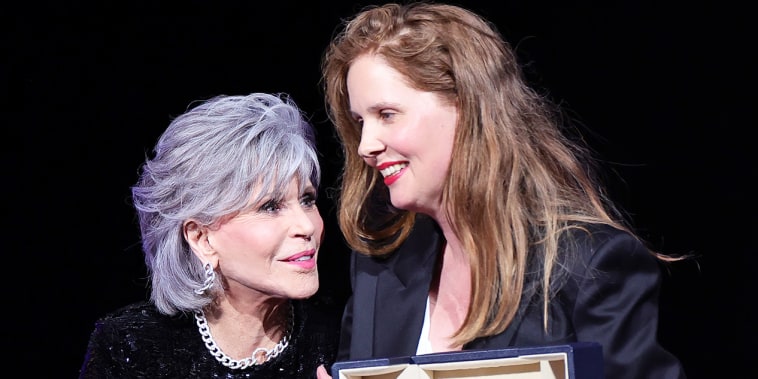 Jane Fonda presents Justine Triet with the Palme D'Or Award for "Anatomy of a Fall" at the 2023 Cannes Film Festival