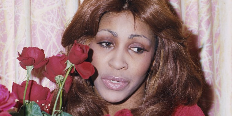 Tina Turner Holding Red Roses