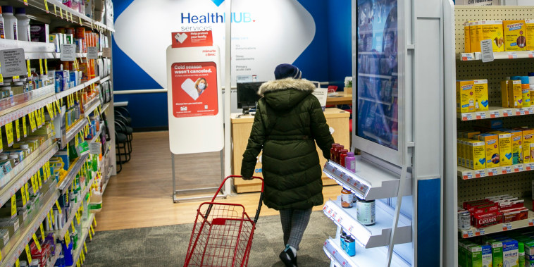 A person walks through a pharmacy in New York