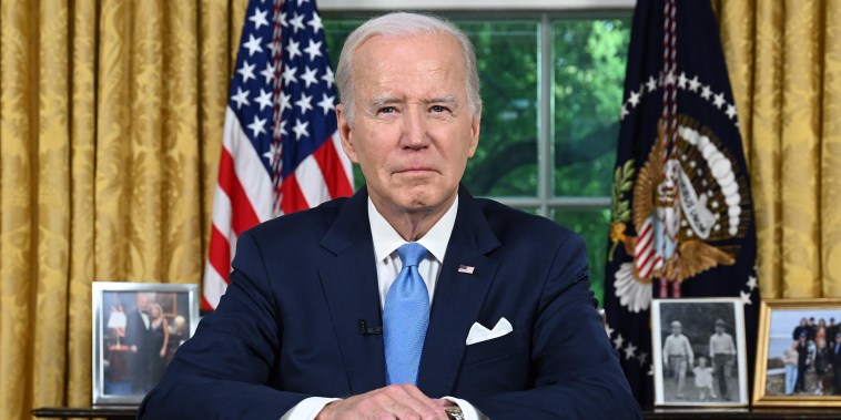 US President Joe Biden sits at his desk ahead of addressing the nation on averting default and the Bipartisan Budget Agreement, in the Oval Office of the White House in Washington, DC, June 2, 2023.