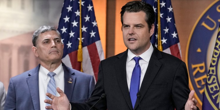 Rep. Matt Gaetz, R-Fla., speaks as Rep. Andrew Clyde, R-Ga., looks on  at the Capitol on Nov. 17, 2022. 