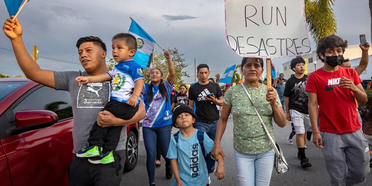 Marchers carried signs and chanted slogans as they marched through the streets of Homestead, Florida on June 1, 2023, to voice their opposition to SB 1718.