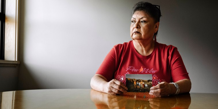 Ernestine Morning Owl holds a family photo that includes her sister Mavis Nelson who went missing and was discovered murdered in a Seattle park last year.