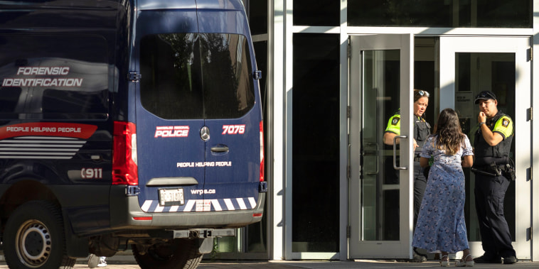 Members of the Waterloo Regional Police investigate a stabbing at the University of Waterloo, in Waterloo, Ontario