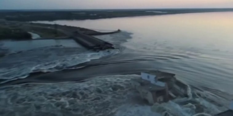 This image from a video posted on social media by Ukrainian President Volodymyr Zelenskyy shows water gushing through the destroyed Khakovka dam in southern Ukraine.