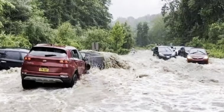 Cars were left stranded by flooding Sunday near Woodbury and Harriman in Orange County, New York.