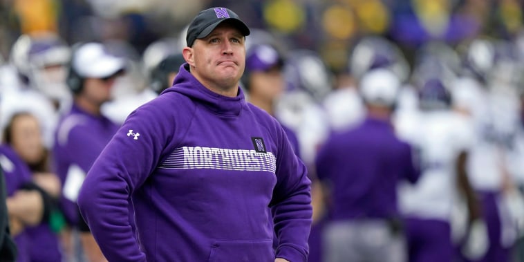 Northwestern coach Pat Fitzgerald stands on the sideline during a game in 2021.