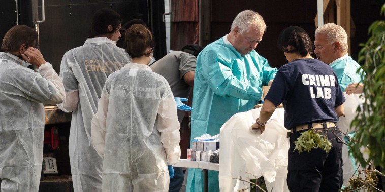 Crime laboratory officers prepare to search the home of Gilgo Beach murders suspect Rex Heuermann in Massapequa Park, New York, on July 18, 2023. Heuermann, a New York architect, was charged on July 14 in connection with the long-unsolved murders of three women whose bodies were found near a beach on Long Island more than a decade ago.