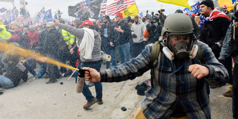 Rioters clash with police and security forces at the Capitol