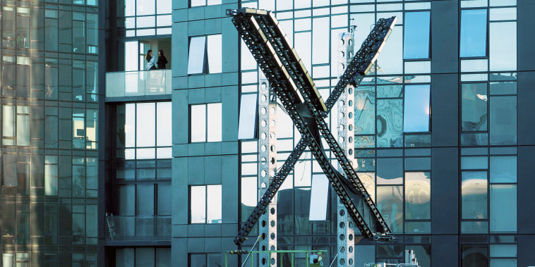 A partially completed "X" sign rests atop the company headquarters, formerly known as Twitter, in downtown San Francisco, on Friday, July 28, 2023. San Francisco has launched an investigation into the sign as city officials say replacing letters or symbols on buildings, or erecting a sign on top of one, requires a permit. (AP Photo/Noah Berger)
