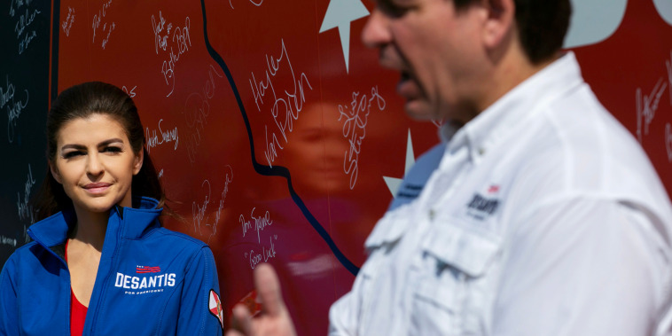 Casey DeSantis listens to her husband, Gov. Ron DeSantis of Florida, talk to press in Cedar Falls, Iowa on August 5, 2023. 