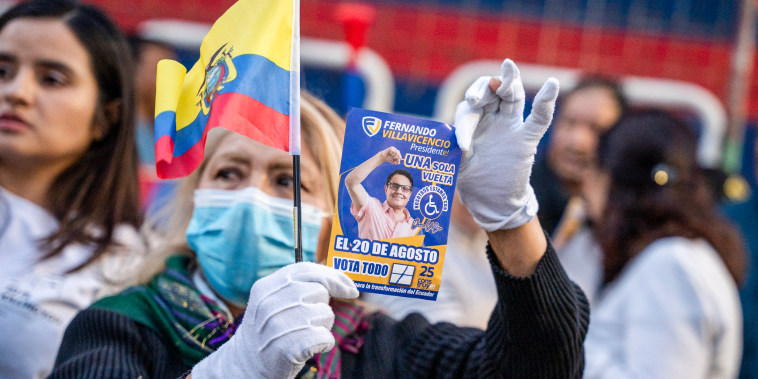 A supporter shows a flyer of slain presidential candidate Fernando Villavicencio during a protest, a day after Villavicencio was shot and killed, in Quito, Ecuador, on Aug. 10, 2023. 
