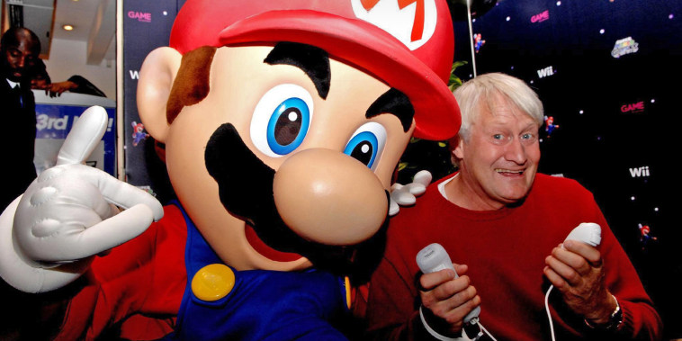 The voice of Super Mario, Charles Martinet, poses with Mario at an event in London in 2007.