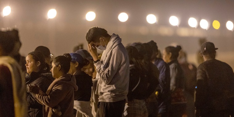 EL PASO, TEXAS - MAY 09: Immigrants seeking asylum in the United States wait to be processed by U.S. border agents after crossing over from Mexico on May 09, 2023 in El Paso, Texas. A surge of immigrants is expected with the end of the U.S. government's Covid-era Title 42 policy, which for the past three years has allowed for the quick expulsion of irregular migrants entering the country. (Photo by John Moore/Getty Images)