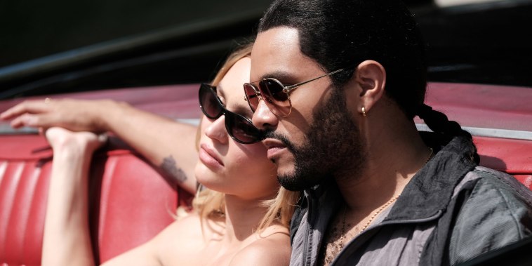 Lily Rose Depp and Abel "The Weeknd" Tesfaye in a red convertible in character for "The Idol"