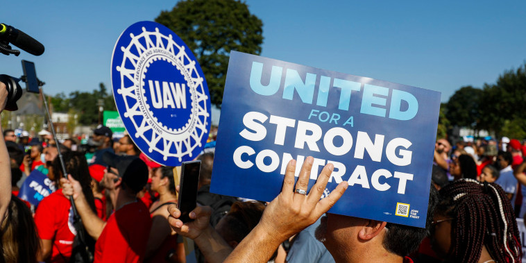 United Auto Workers members and others gather for a rally after marching in the Labor Day parade in Detroit on Sept. 4, 2023.