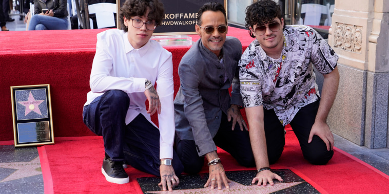From left, Ryan Muniz, Marc Anthony, and Cristian Muniz attend a ceremony honoring Anthony with a star on the Hollywood Walk of Fame, in Los Angeles
