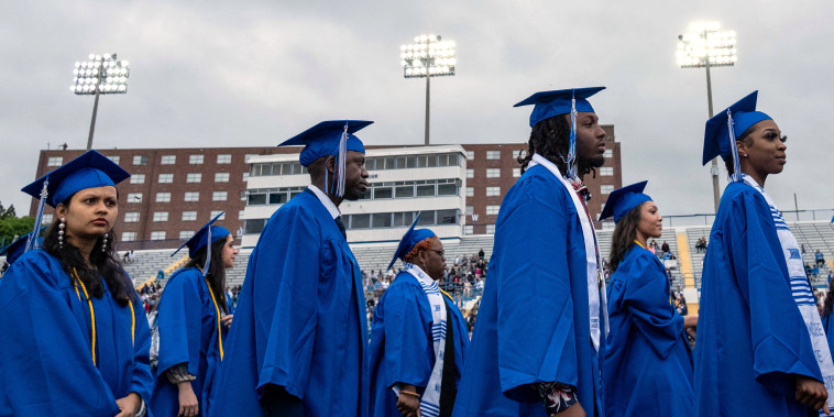 Students of Tennessee State University walk to their seats during a graduation ceremony
