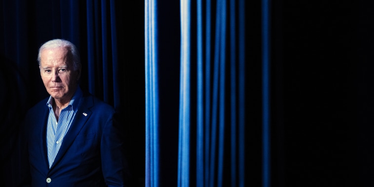President Joe Biden waits to walk on stage during a virtual event with the National Education Association at the White House