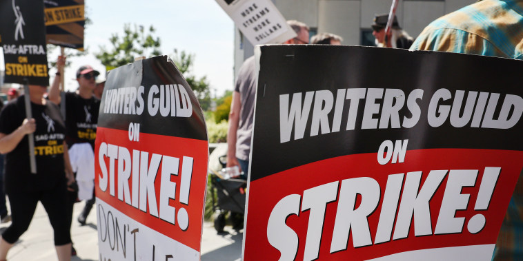 Striking Writers Guild of America and SAG-AFTRA members picket  outside Netflix studios on September 22, 2023 in Los Angeles.
