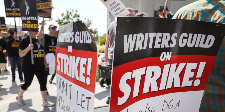 Striking WGA (Writers Guild of America) members picket with striking SAG-AFTRA members outside Netflix studios on September 22, 2023 in Los Angeles, California. The Writers Guild of America and Alliance of Motion Picture and Television Producers (AMPTP) are reportedly meeting for a third straight day today in a new round of contract talks in the nearly five-months long writers strike.