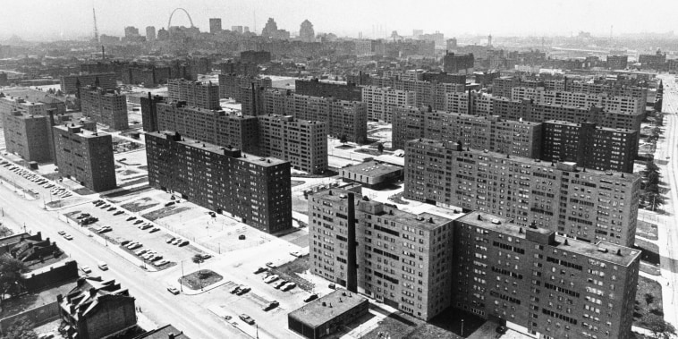 (Original Caption) St. Louis: Aerial view made June 5, 1971 shows the massive Pruitt-Igoe housing project with its busted windows and the St. Louis Gateway Arch in background. Most of the 35 buildings in the complex are vacant.