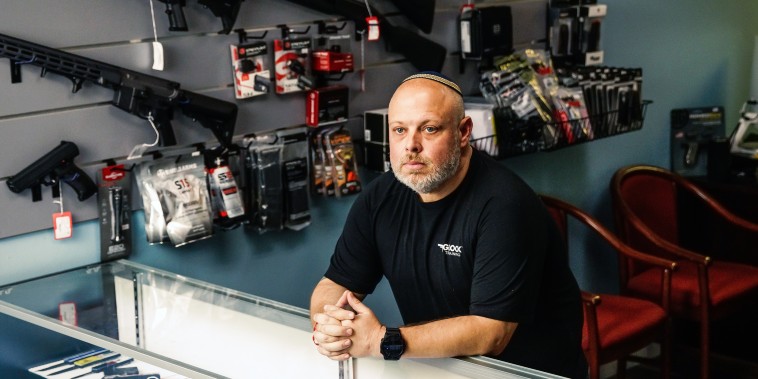 David Kowalsky, 48, owner of Florida Gun Store, stands for a portrait in his shop in Hollywood, Fla.