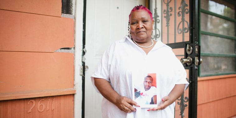 Image: Bettersten Wade holds a photo of her son, Dexter.