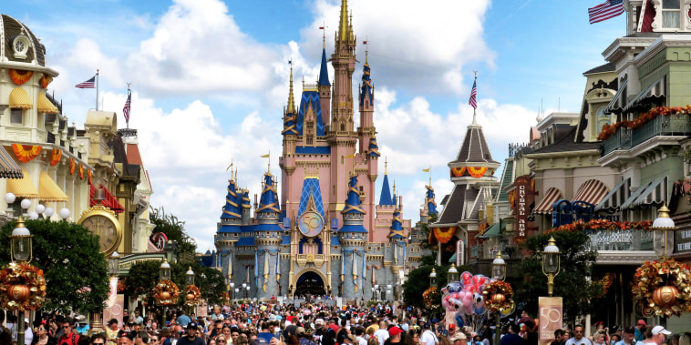 Crowds fill Main Street USA in front of Cinderella Castle at the Magic Kingdom on the 50th anniversary of Walt Disney World, in Lake Buena Vista, Florida, on Oct. 1, 2021.