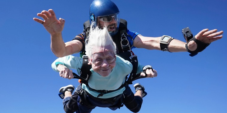 Dorothy Hoffner, 104, falling through the air with tandem jumper Derek Baxter