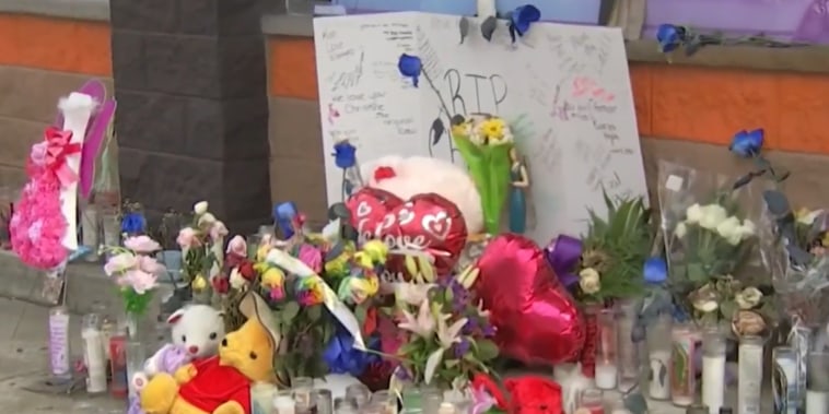A memorial for Christine Lugo outside a Dunkin' in Philadelphia where she worked.