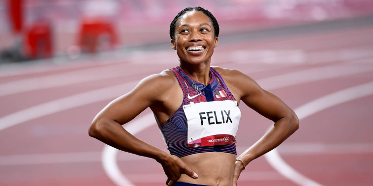 Allyson Felix smiles after winning the bronze medal in the 400m race at the 2020 Tokyo Olympics.  