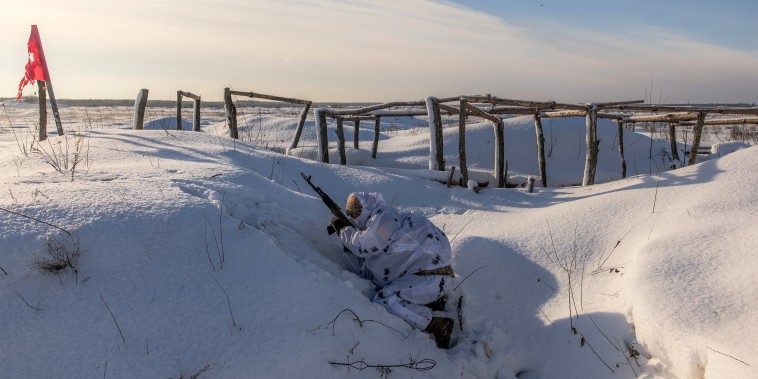 A Ukrainian soldier participates in sabotage training in a snowy field on Dec. 5.