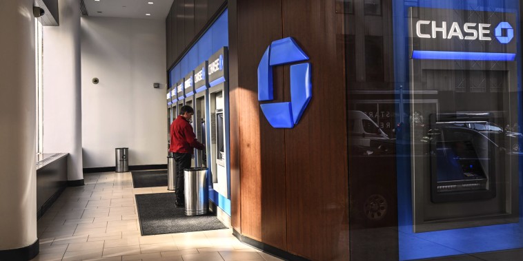 A person uses a Chase Bank atm.