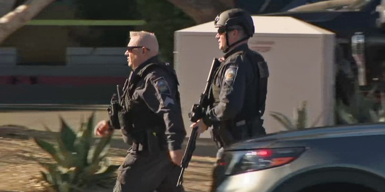 Police respond at the scene of a shooting at the University of Las Vegas.