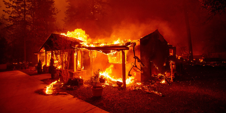 A home burns during the Camp fire in Paradise, Calif., in 2018.