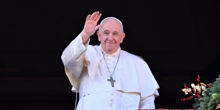 Pope Francis appears at the balcony to deliver his Christmas blessing in 2022. 