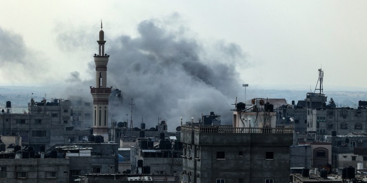Smoke rises above buildings in Rafah.