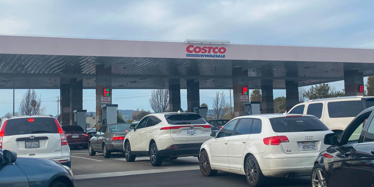 Cars are waiting to pump gas at a Costco gas station