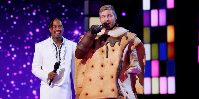 Nick Cannon and Ashley Parker Angel  in the “Disco Night” episode of "The Masked Singer" on Wednesday, Nov. 29, 2023.  