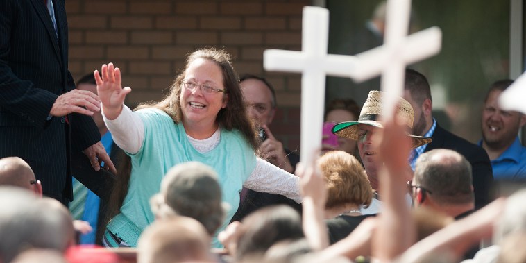 Rowan County Clerk of Courts Kim Davis waves to a crowd of her supporters at a rally in front of the Carter County Detention Center on Sept. 8, 2015 in Grayson, Ky.