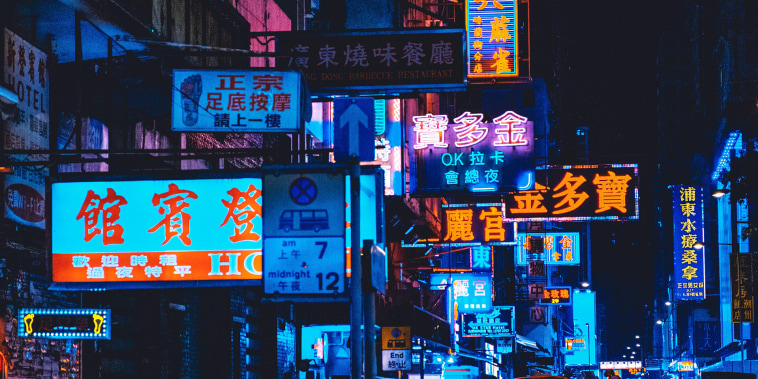 Hongkong, Hong Kong - November, 2019:  Neon lights and shop signs in Hong Kong streets at night