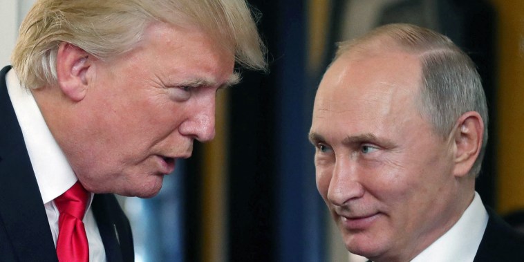 Donald Trump, left, chats with Vladimir Putin