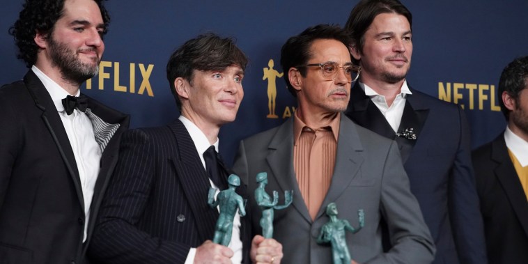 From left, Benny Safdie, Cillian Murphy, Robert Downey Jr., and Josh Hartnett, winners of the award for outstanding performance by a cast in a motion picture for "Oppenheimer," at the 30th annual Screen Actors Guild Awards on Saturday, Feb. 24, 2024, in Los Angeles.