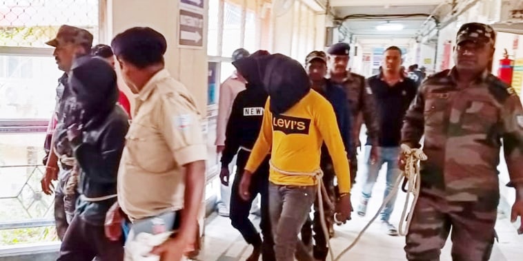 Three Indian men have appeared in court after the gang rape of a Spanish tourist on a motorbike trip with her husband, with police hunting four other suspects, reports said on March 4. 
